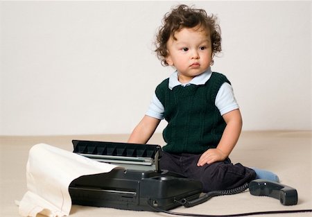 Little child playing with fax. Stock Photo - Budget Royalty-Free & Subscription, Code: 400-04136676
