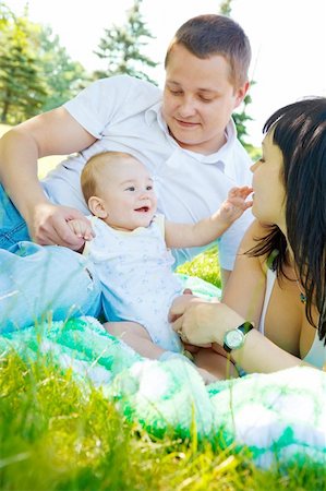 small babies in park - Young family playing in the summer park Stock Photo - Budget Royalty-Free & Subscription, Code: 400-04136783