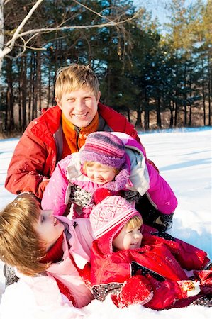 simsearch:400-07715953,k - Joyful family enjoying their weekend in a winter park Stock Photo - Budget Royalty-Free & Subscription, Code: 400-04136824