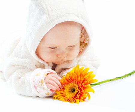 simsearch:400-04637418,k - Baby with orange flower, isolated Stock Photo - Budget Royalty-Free & Subscription, Code: 400-04136836