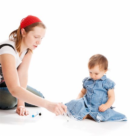 Mother teaching her daughter to write Stock Photo - Budget Royalty-Free & Subscription, Code: 400-04136850
