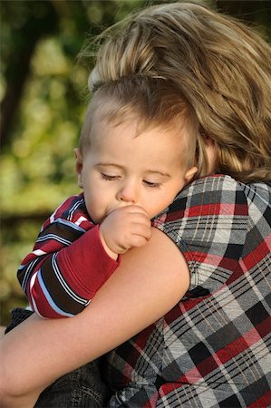 simsearch:400-04535025,k - Little boy sleeping on mother's shoulder Stock Photo - Budget Royalty-Free & Subscription, Code: 400-04136996