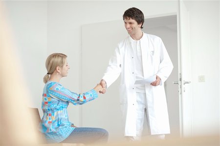 Doctor and patient, in waiting room, greetings and welcome smiling doctor Stock Photo - Budget Royalty-Free & Subscription, Code: 400-04137280