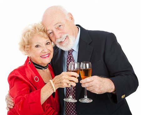 simsearch:400-08040653,k - Beautiful senior couple toasting with glasses of champagne.  Isolated on white. Stock Photo - Budget Royalty-Free & Subscription, Code: 400-04137954