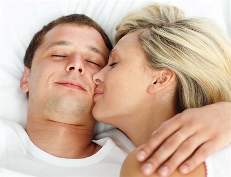 simsearch:400-04150404,k - Close-up of girlfriend kissing her boyfriend in bed Stock Photo - Budget Royalty-Free & Subscription, Code: 400-04138195