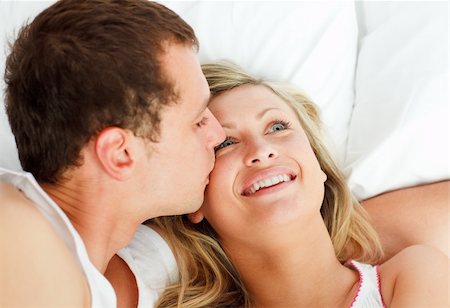 simsearch:400-04150404,k - Close-up of boyfriend kissing his girlfriend in bed Stock Photo - Budget Royalty-Free & Subscription, Code: 400-04138200