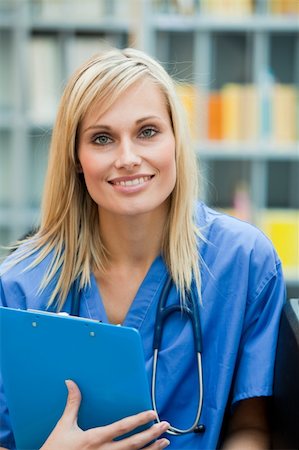 simsearch:400-04140639,k - Young blond doctor at work in hospital smiling at the camera Stock Photo - Budget Royalty-Free & Subscription, Code: 400-04138314