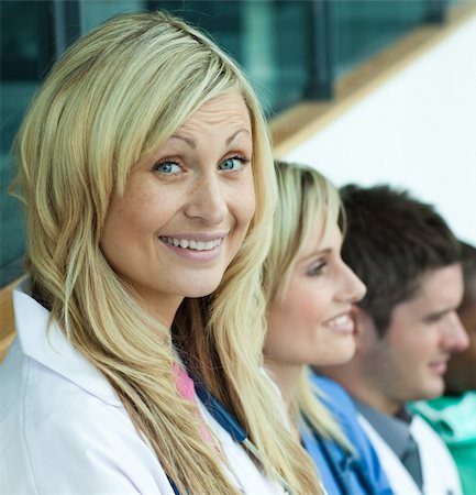 doctor speaking to young patient - Group of doctors  in a hospital office and smiling Stock Photo - Budget Royalty-Free & Subscription, Code: 400-04138344