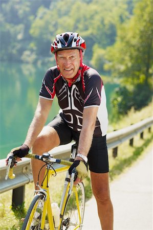 senior man on road bike, looking at camera. Stock Photo - Budget Royalty-Free & Subscription, Code: 400-04138351