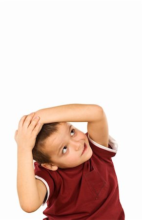 Little boy covering head with hands to escape something while looking up - isolated, copy space Stock Photo - Budget Royalty-Free & Subscription, Code: 400-04139382