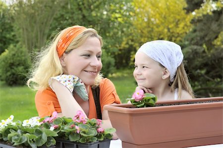 family backyard gardening not barbeque - Mother and daughter having gardening time Stock Photo - Budget Royalty-Free & Subscription, Code: 400-04139514