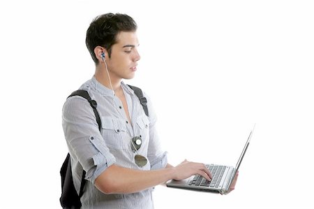 Devoirs du jeune étudiant avec ordinateur portable isolé sur fond blanc Photographie de stock - Aubaine LD & Abonnement, Code: 400-04130403