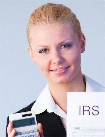 simsearch:400-05339747,k - Business woman looking at filling in tax returns Stock Photo - Budget Royalty-Free & Subscription, Code: 400-04130514