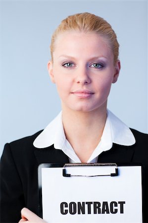 simsearch:400-05895521,k - Young Woman holding a contract on a clipboard Stock Photo - Budget Royalty-Free & Subscription, Code: 400-04130521