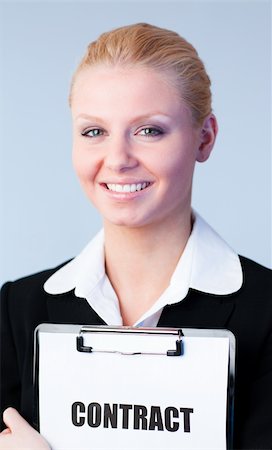 simsearch:400-05895521,k - Young Woman holding a contract on a clipboard Stock Photo - Budget Royalty-Free & Subscription, Code: 400-04130522