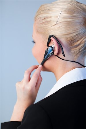 Young Business woman using a headset Stock Photo - Budget Royalty-Free & Subscription, Code: 400-04130542