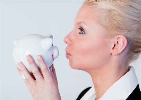 Businesss Woman kissing a piggy Bank Stock Photo - Budget Royalty-Free & Subscription, Code: 400-04130630