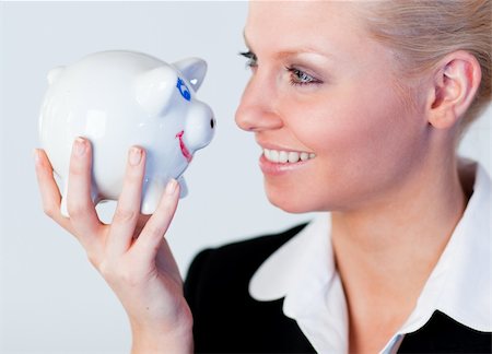 Young Business woman holding a piggy Bank Stock Photo - Budget Royalty-Free & Subscription, Code: 400-04130640