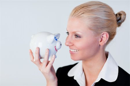 Young Business woman holding a piggy Bank Stock Photo - Budget Royalty-Free & Subscription, Code: 400-04130641
