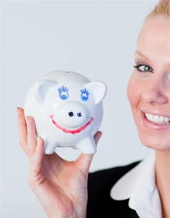 Young Business woman holding a piggy Bank Stock Photo - Budget Royalty-Free & Subscription, Code: 400-04130642