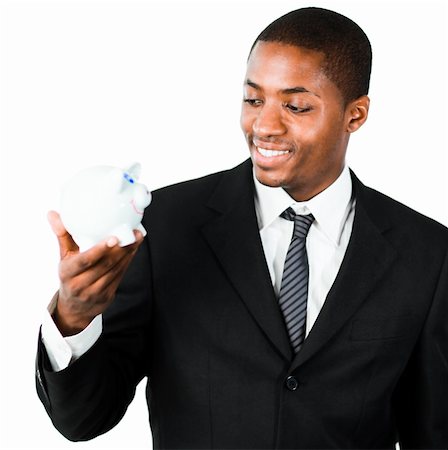 simsearch:400-05718322,k - Close-up of an young African businessman looking at a piggy bank Fotografie stock - Microstock e Abbonamento, Codice: 400-04130698