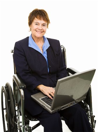 Pretty, smiling businesswoman in a wheelchair working on her laptop computer.  Isolated. Stock Photo - Budget Royalty-Free & Subscription, Code: 400-04131211