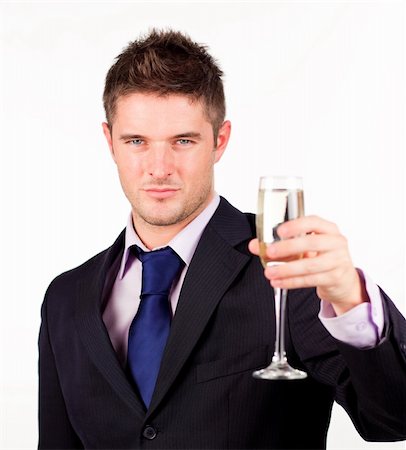 executive and toast - Businessman holding a champagne glass with focus on the person Stock Photo - Budget Royalty-Free & Subscription, Code: 400-04131241
