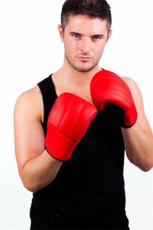simsearch:400-05880401,k - Young athletic man wearing boxing gloves Stock Photo - Budget Royalty-Free & Subscription, Code: 400-04131304