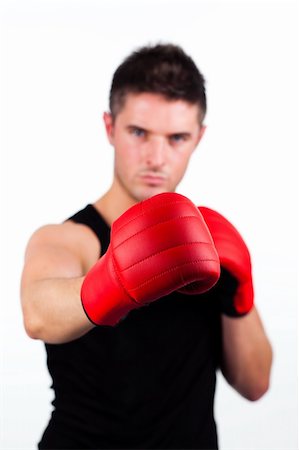 simsearch:400-05880401,k - Young athletic man wearing boxing gloves Stock Photo - Budget Royalty-Free & Subscription, Code: 400-04131306