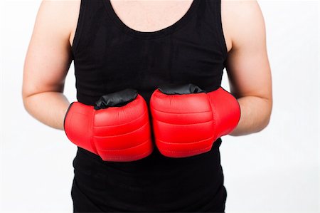 simsearch:400-05880401,k - Young athletic man wearing boxing gloves Stock Photo - Budget Royalty-Free & Subscription, Code: 400-04131309