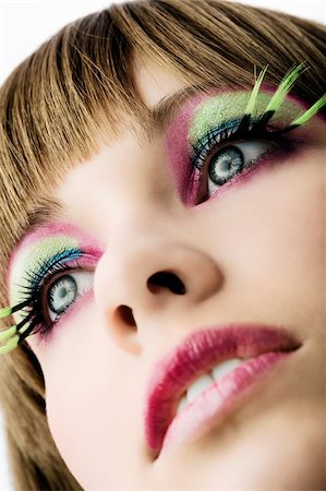 simsearch:400-04552932,k - close up on face of beautiful girl with green long eyelashes and color makeup Stock Photo - Budget Royalty-Free & Subscription, Code: 400-04132217