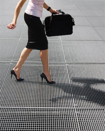 side view of business woman balancing on high heels. Copy space Stock Photo - Budget Royalty-Free & Subscription, Code: 400-04132422