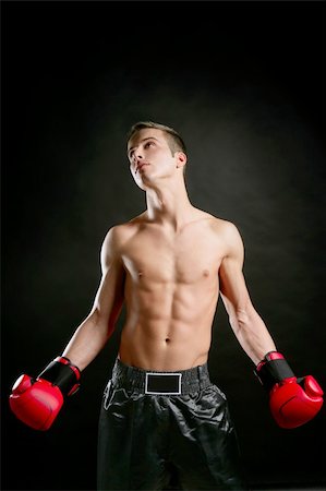 simsearch:400-08333281,k - Boxer, young age handsome man over black background Stock Photo - Budget Royalty-Free & Subscription, Code: 400-04132490