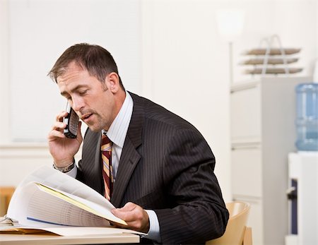 simsearch:400-04129016,k - Businessman talking on telephone Stock Photo - Budget Royalty-Free & Subscription, Code: 400-04132779