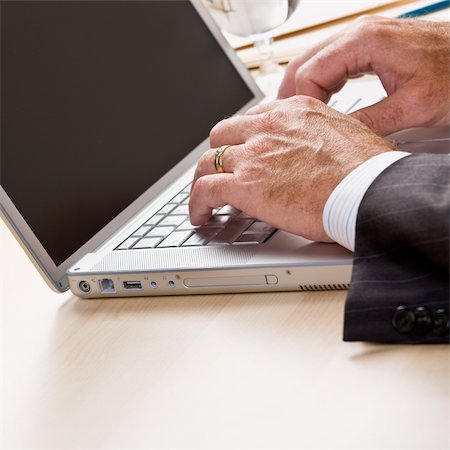 simsearch:400-04129016,k - Close up of businessman typing on laptop Stock Photo - Budget Royalty-Free & Subscription, Code: 400-04132783