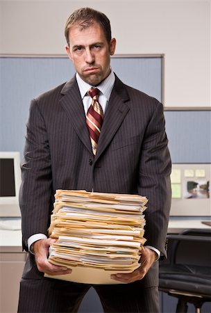 enterprise group - Businessman carrying stack of file folders Stock Photo - Budget Royalty-Free & Subscription, Code: 400-04132818