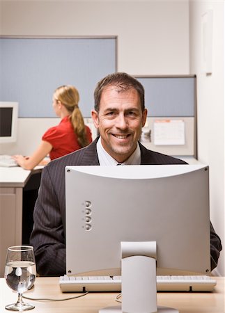 simsearch:400-04129016,k - Businessman typing on computer at desk Stock Photo - Budget Royalty-Free & Subscription, Code: 400-04132826