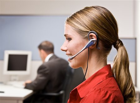 simsearch:400-04129016,k - Businesswoman talking on headset at desk Stock Photo - Budget Royalty-Free & Subscription, Code: 400-04132831