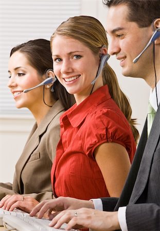 simsearch:400-04129016,k - Business people talking on headsets Stock Photo - Budget Royalty-Free & Subscription, Code: 400-04132887