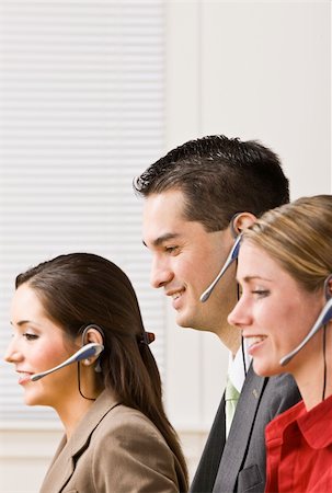simsearch:400-04129016,k - Business people talking on headsets Stock Photo - Budget Royalty-Free & Subscription, Code: 400-04132888