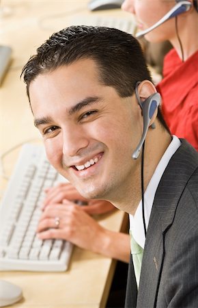 simsearch:400-04129016,k - Businessman talking on headsets Stock Photo - Budget Royalty-Free & Subscription, Code: 400-04132894