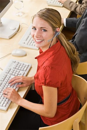 simsearch:400-04129016,k - Businesswoman talking on headsets Stock Photo - Budget Royalty-Free & Subscription, Code: 400-04132892