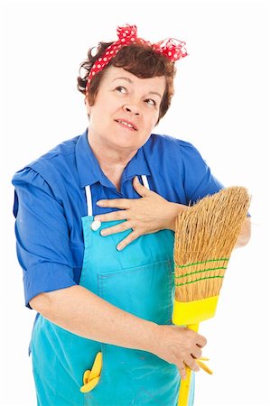 Attractive middle aged housekeeper fantasizes about a better life.  Isolated on white. Stock Photo - Budget Royalty-Free & Subscription, Code: 400-04133153