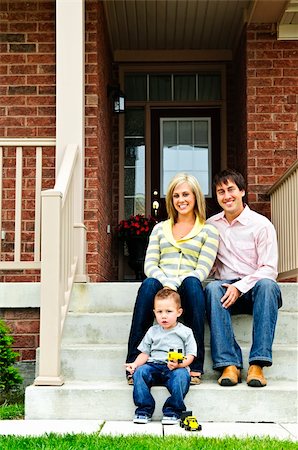 father child yard not illustration not business not vintage not 20s not 30s not 40s not 70s not 80s - Young family sitting on front steps of house Stock Photo - Budget Royalty-Free & Subscription, Code: 400-04133254