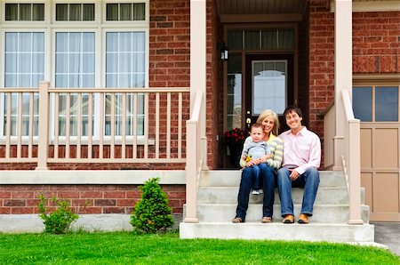 father child yard not illustration not business not vintage not 20s not 30s not 40s not 70s not 80s - Young family sitting on front steps of house Stock Photo - Budget Royalty-Free & Subscription, Code: 400-04133251