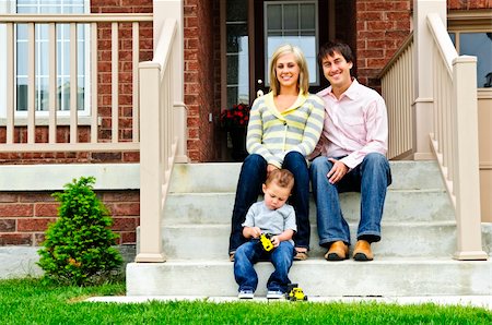 father child yard not illustration not business not vintage not 20s not 30s not 40s not 70s not 80s - Young family sitting on front steps of house Stock Photo - Budget Royalty-Free & Subscription, Code: 400-04133253