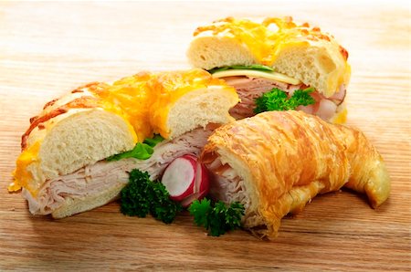 Assorted bagel and croissant sandwiches with meat and vegetables Stock Photo - Budget Royalty-Free & Subscription, Code: 400-04133269