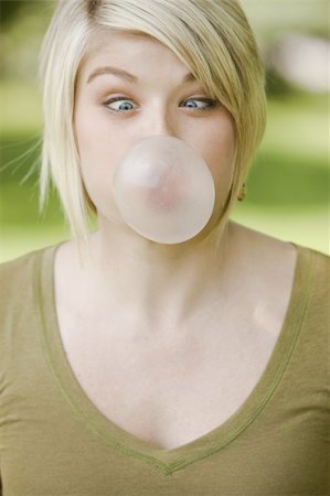 funny pictures people chewing gum - Close-up portrait of a young woman blowing bubble gum Stock Photo - Budget Royalty-Free & Subscription, Code: 400-04133779