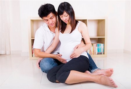 Husband and 8 months pregnant wife. Stock Photo - Budget Royalty-Free & Subscription, Code: 400-04133797