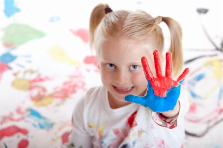 child shows her painted hand during painting session Stock Photo - Budget Royalty-Free & Subscription, Code: 400-04133874